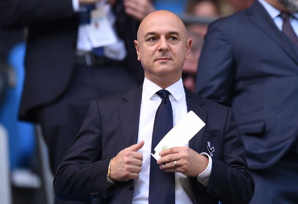 Daniel Levy taking a piece of paper out of his pocket.