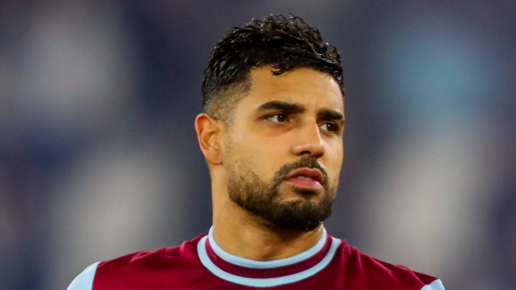 West Ham defender Emerson looks on.