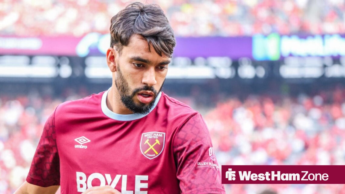 Lucas Paqueta in a West Ham kit looking towards the ground
