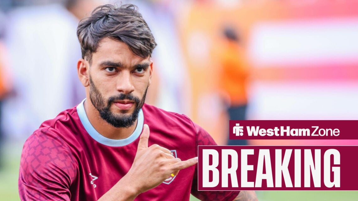 Lucas Paqueta does a hand gesture in his West Ham training kit.