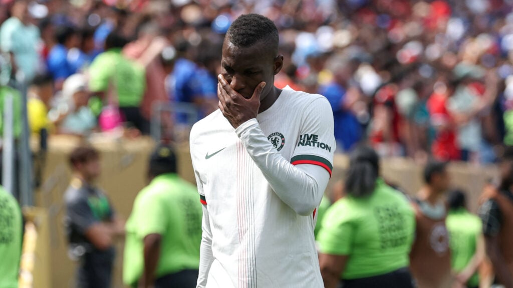 Chelsea star Nicolas Jackson covers his face during a game.