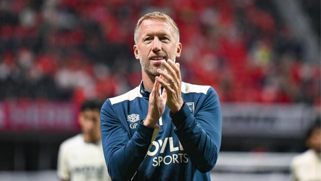 Graham Potter smiling and clapping at West Ham.