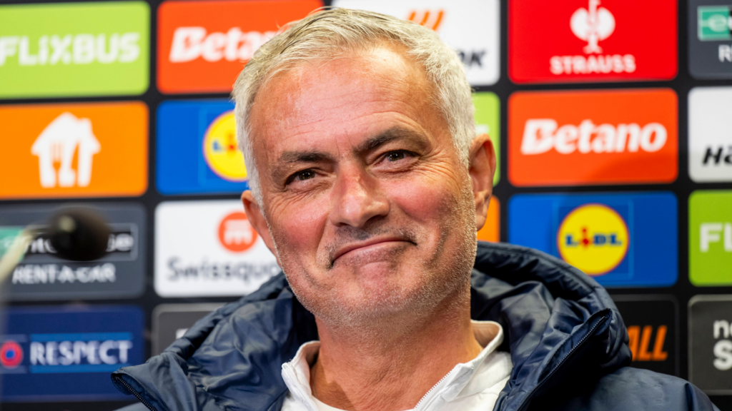 Jose Mourinho smiling in a press conference
