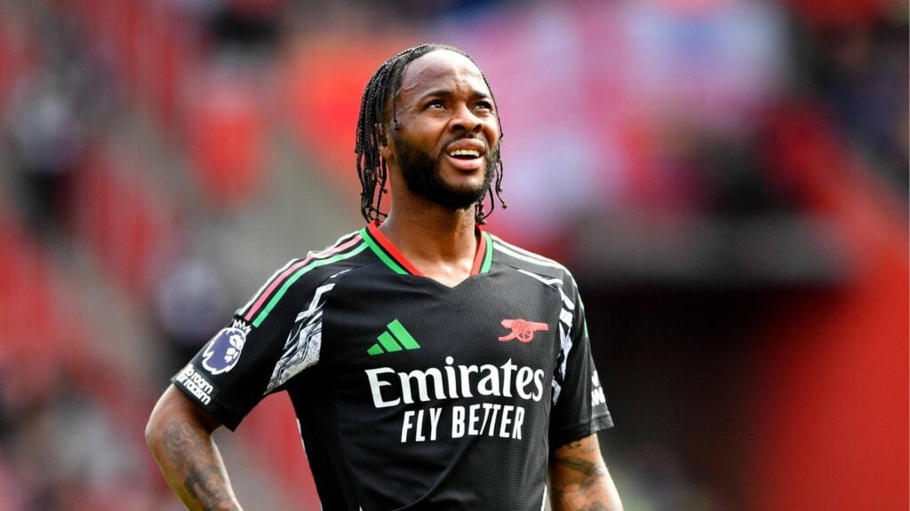 Raheem Sterling looking to the skies in Arsenal away kit.