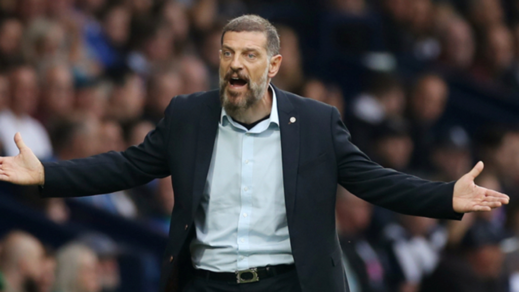 Slaven Bilic holding his hands out by his side shouting