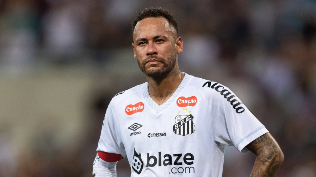 Neymar with his hands on his hips.