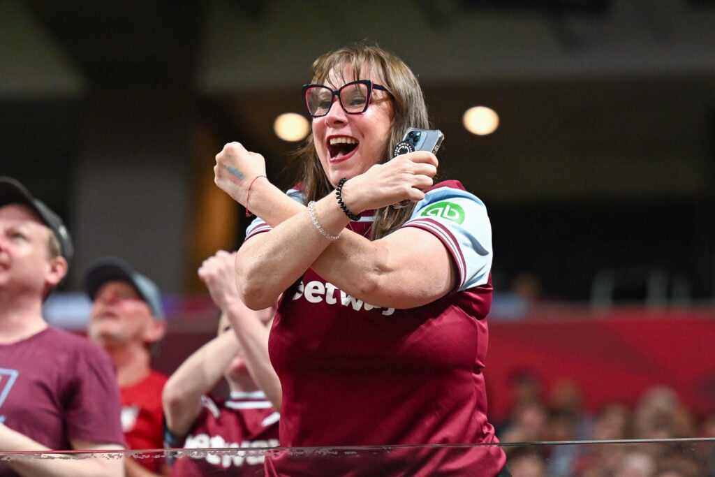 West Ham fan holding up the Irons symbol