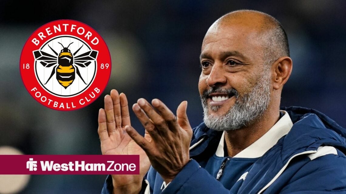 Nuno Espirito Santo smiling while looking at the bretnford badge