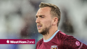 Jarrod Bowen looks on in a West Ham shirt.