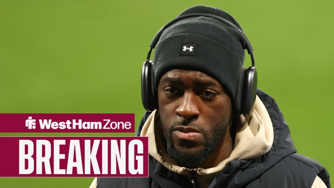 Axel Disasi looking straight ahead with headphones on.