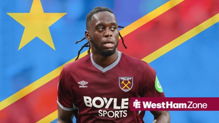 Aaron Wan-Bissaka 29 runs during a match between Manchester United and West Ham United, DR Congo flag in background.